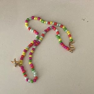 Glass bead gold starfish charm necklace